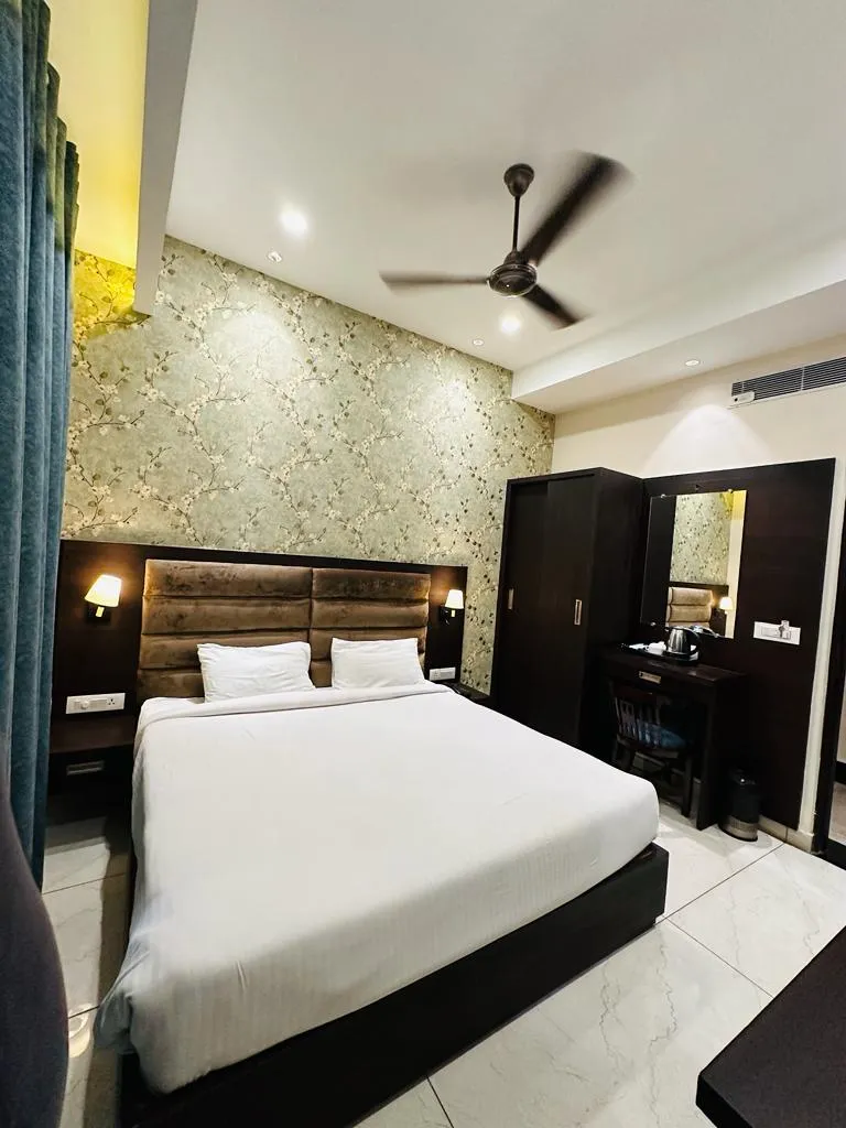 Semi Deluxe Room at The Grand Regency Pathankot featuring modern floral accent wall